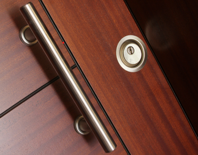 Acoustic wooden door installed to provide enhanced sound insulation